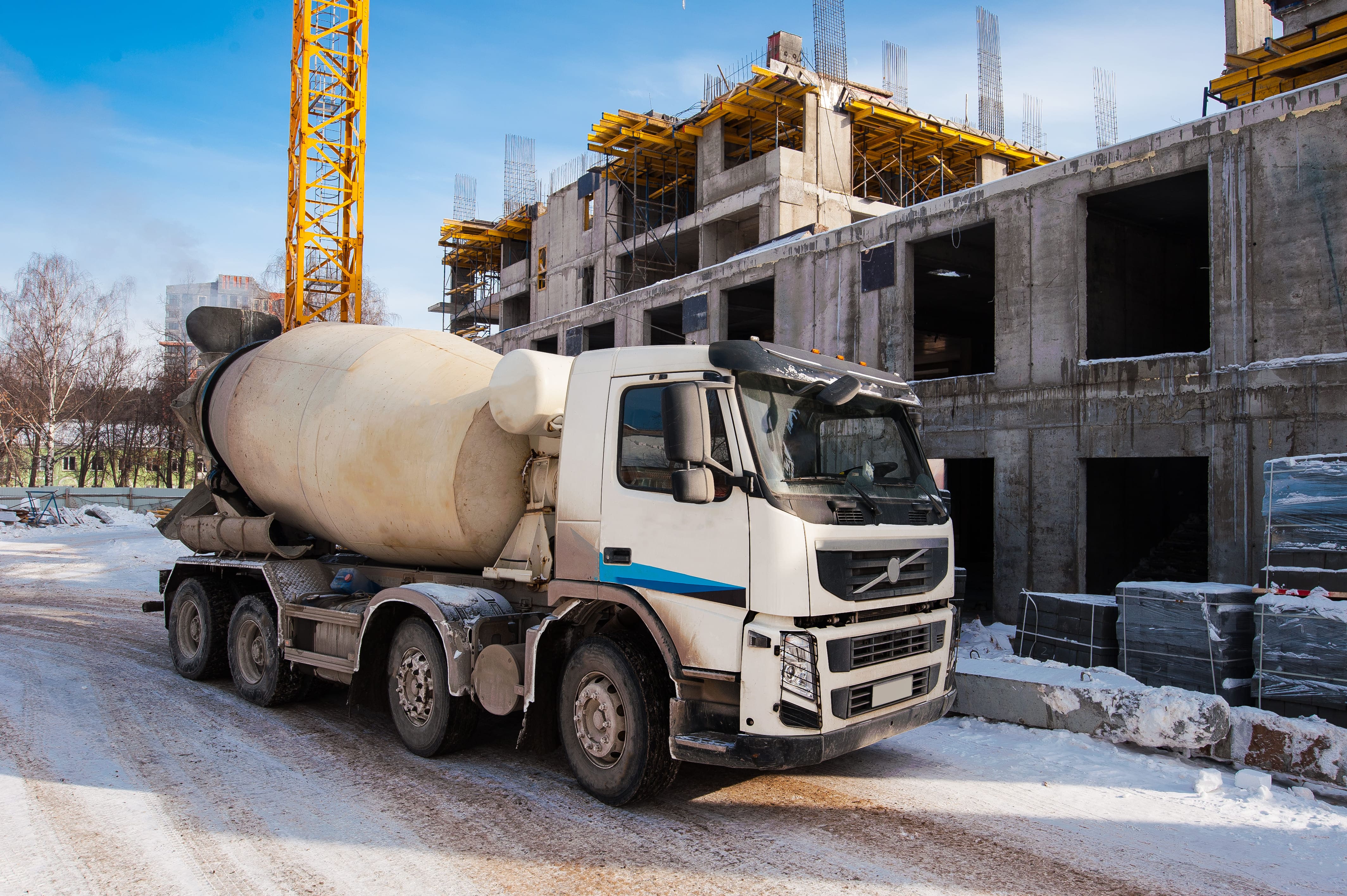 concrete mixer truck stands on construction site in winter 1 1